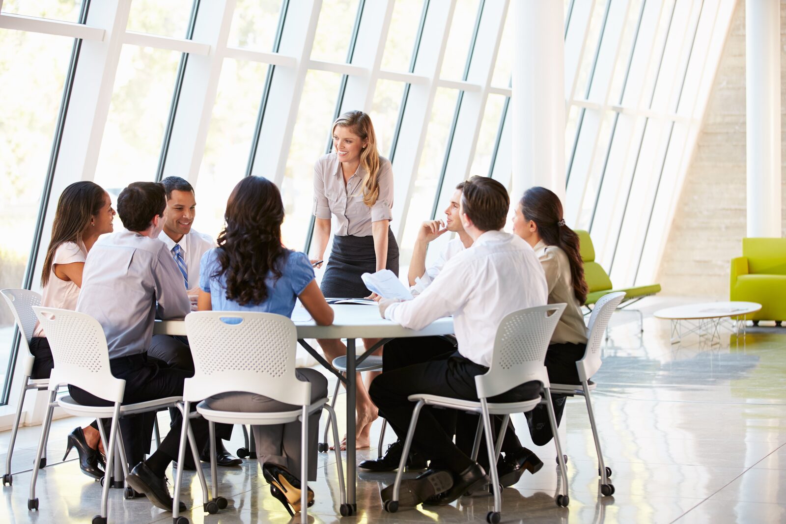 A diverse team collaborates in a bright training room, showcasing our vocational education training services.
