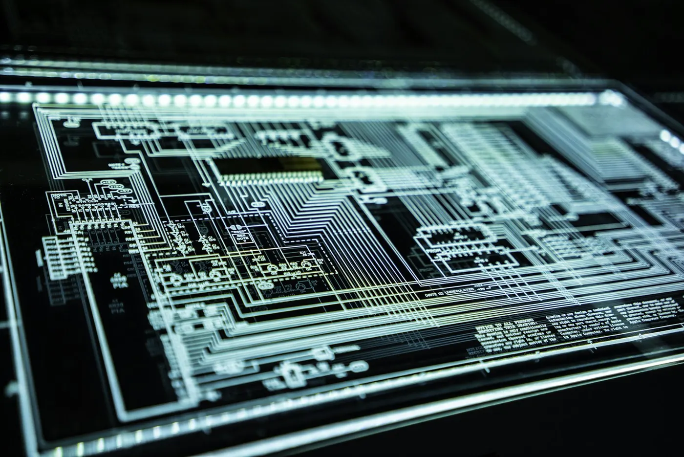 A glowing circuit board schematic represents the complex technology behind vocational education and training.