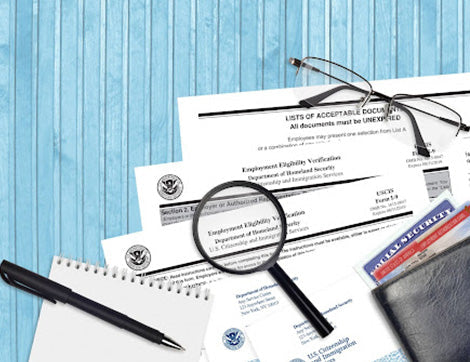 Documents for employment eligibility verification, including an I-9 form and social security card are displayed as part of.