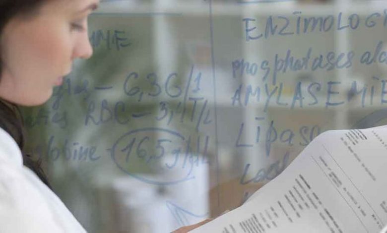 A scientist analyzes data in a laboratory setting, demonstrating the importance of quality assurance for vocational.