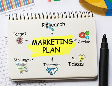 Marketing Plan | Career Calling International A notepad shows a marketing plan outlining research, strategy and teamwork for vocational education training.